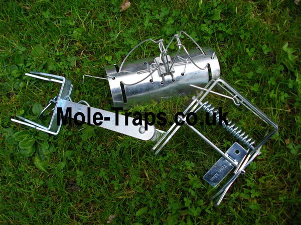 One of each mole trap one tunnel mole trap, one scissor mole trap & a talpex mole trap